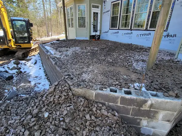 Stone fill packed inside the block deck foundation
